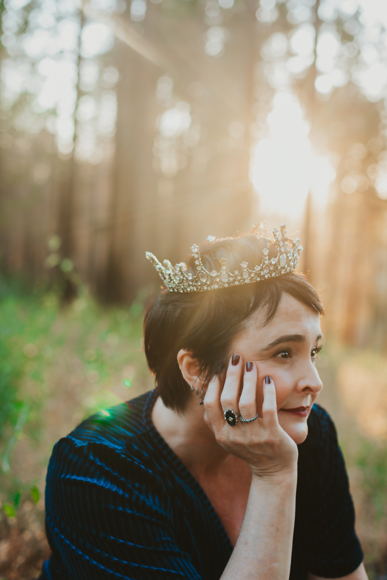 Kelly Blackwell, wearing a crown in the pines